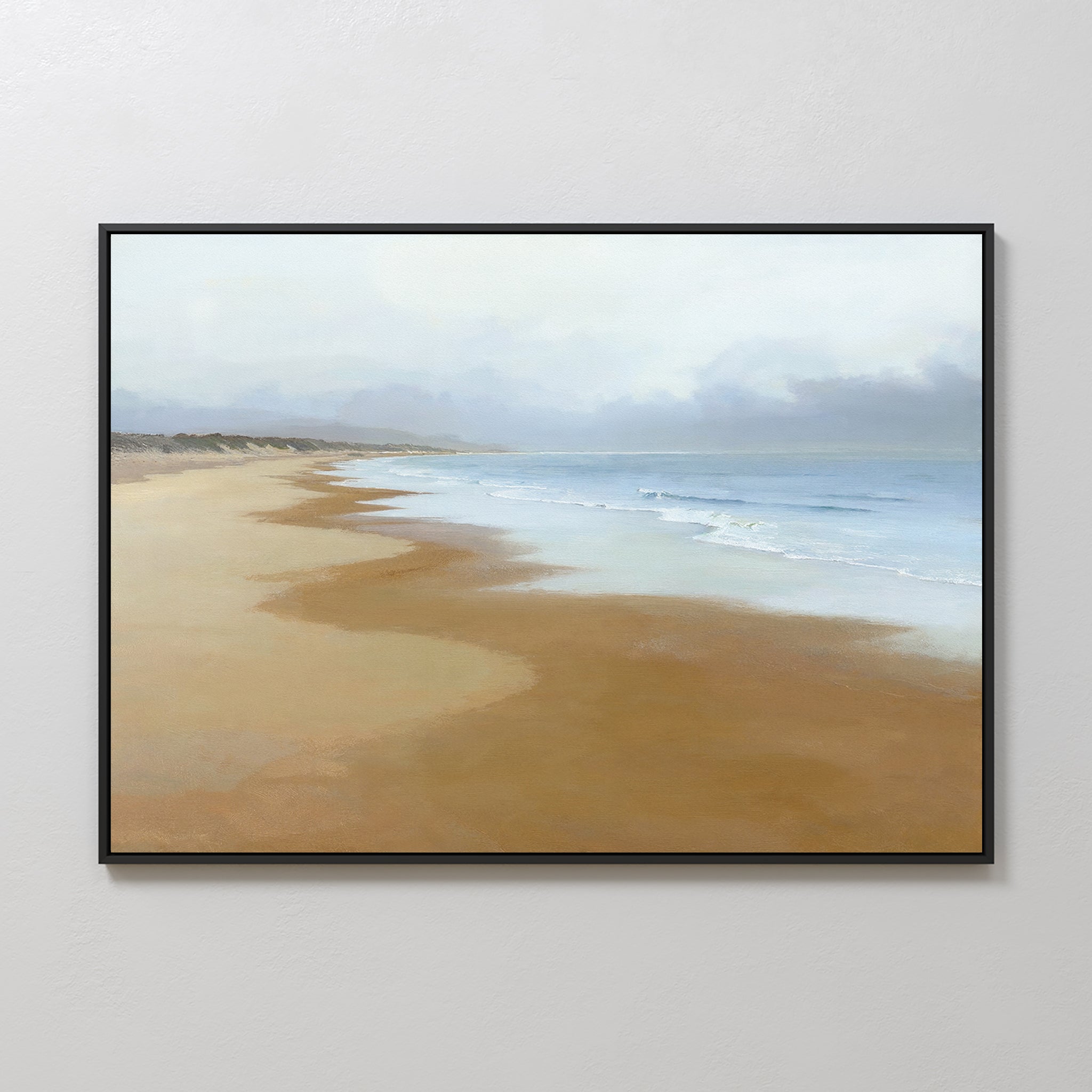 The Endless Shoreline Canvas Art - Horizontal features a tranquil beach with soft waves, light brown sand, and a cloudy sky—serene wall art perfect for calming any space.