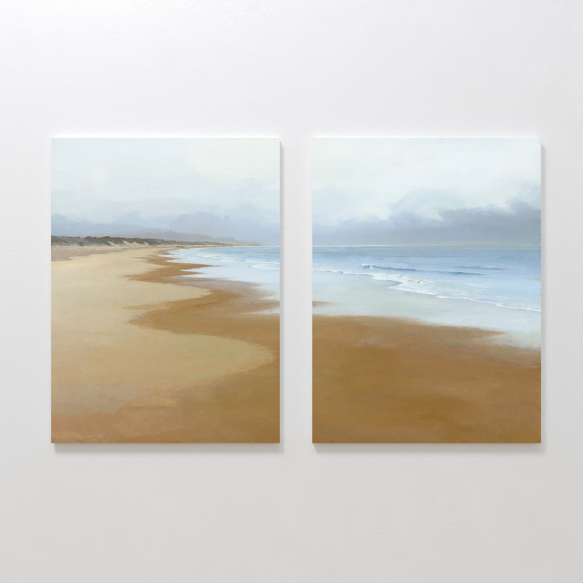 Endless Shoreline - Set of 2 features side-by-side wall art with a tranquil beach, golden sand, gentle waves, a cloudy sky, and a curving shore—bringing peaceful coastal beauty to any space.