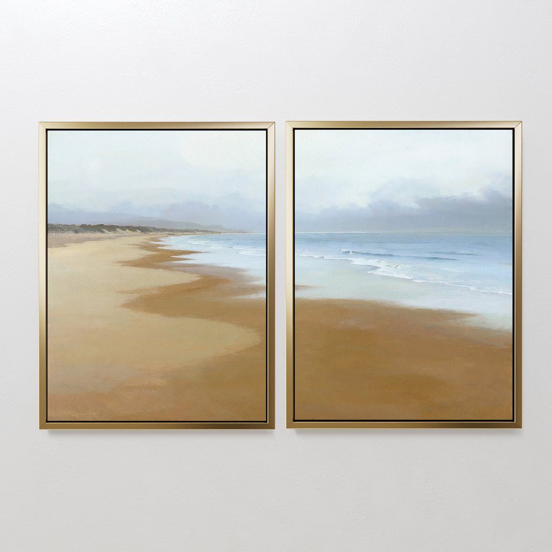 The Endless Shoreline - Set of 2 features framed coastal canvas prints with sandy shores, gentle waves, and a cloudy sky, creating a seamless beach landscape—ideal serene wall art for any space.