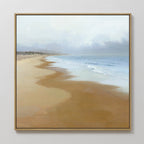 The Endless Shoreline Canvas Art - Square, featuring a peaceful beach with gentle waves, light brown sand, and a cloudy sky, hangs on a white wall for a serene coastal touch.