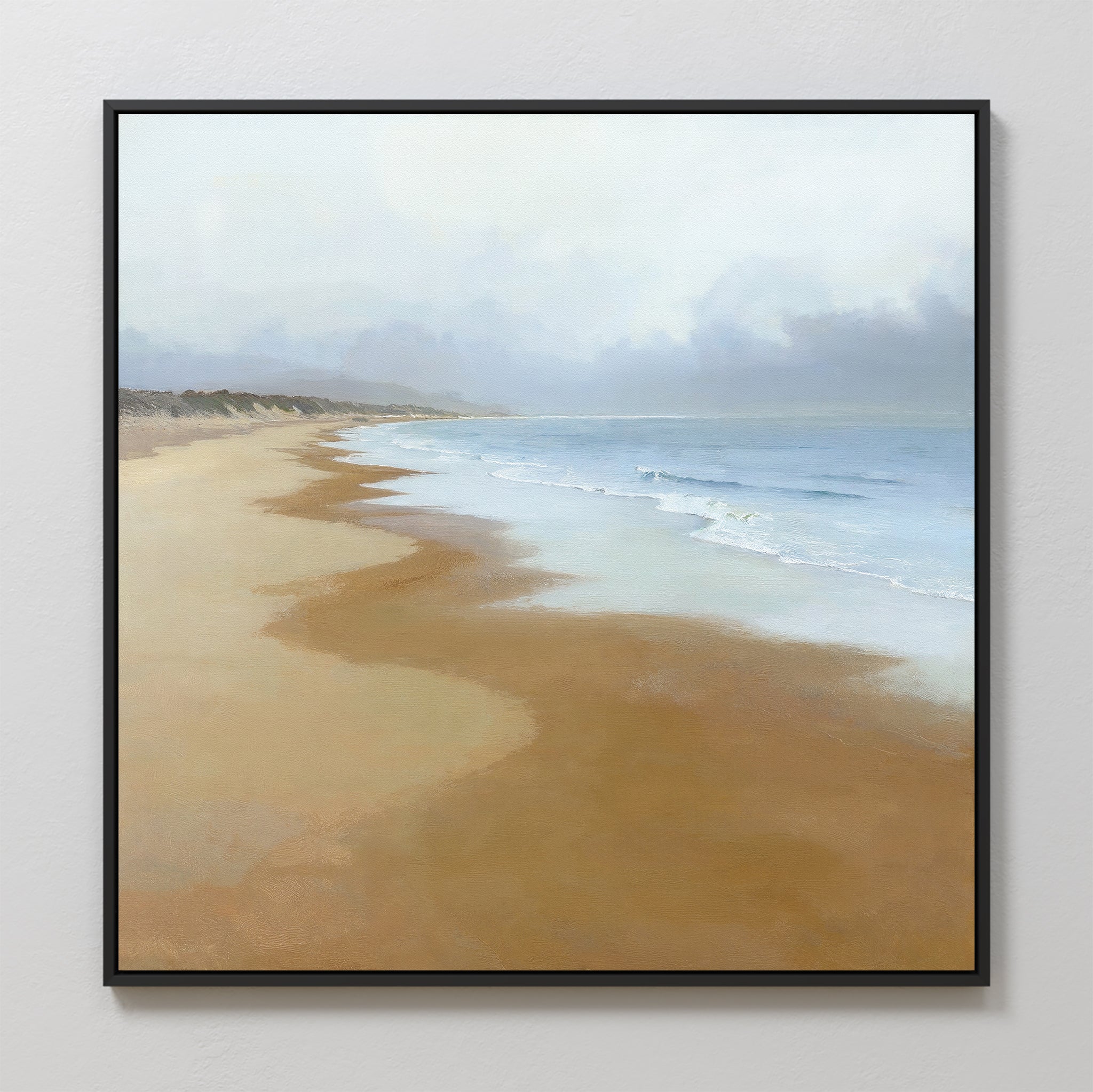 Endless Shoreline Canvas Art - Square features a tranquil beach with gentle waves, sandy shore, and hazy sky in soft, muted colors—ideal for serene home decor.