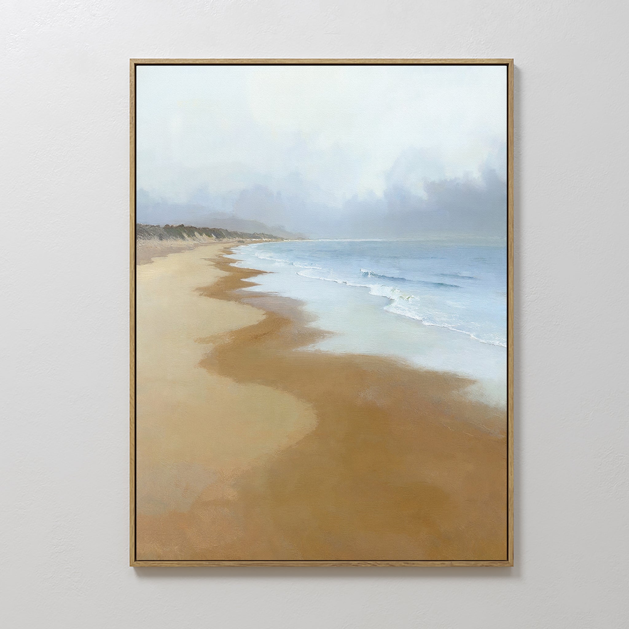 The Endless Shoreline Canvas Art - Vertical features a serene beach scene with gentle waves, sandy shore, and misty sky in soft, muted colors. This calming coastal print makes a peaceful addition to any space.