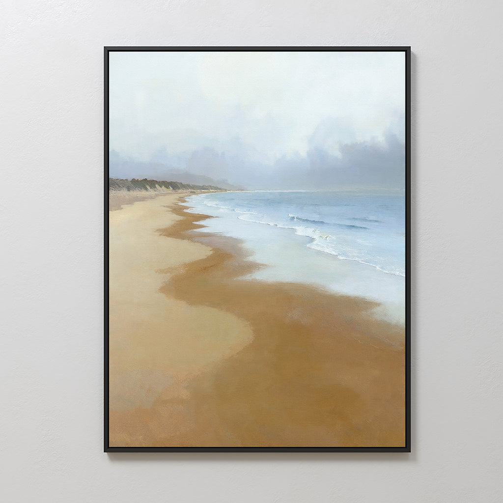 The Endless Shoreline Canvas Art - Vertical features a calm beach with gentle waves, soft sand, and a hazy sky. Muted colors and a curving coastline create serene wall art perfect for tranquil interiors.
