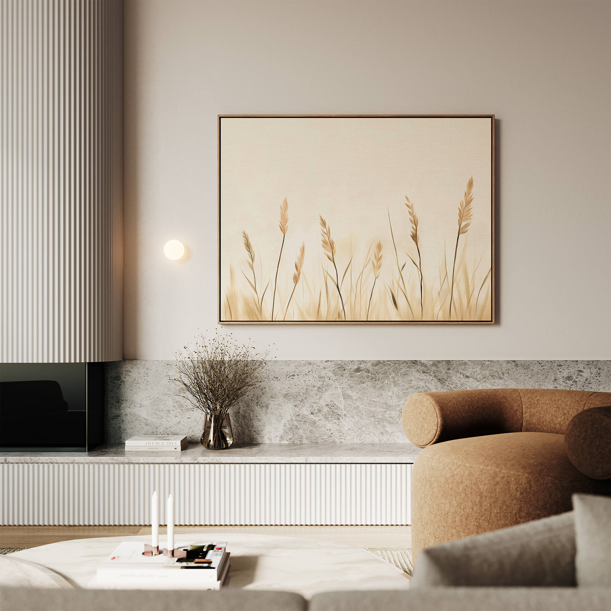 A modern living room featuring a light brown sofa, marble surfaces, neutral-toned decor in soft lighting, and the Whispering Reeds Canvas Art framed on the wall above a minimalist vase with dried plants.