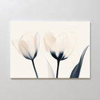 The Ethereal Blooms Canvas Art - Horizontal features two pale tulips with dark stems and leaves on a light background, showcasing soft petals and elegant lines—an ideal touch of subtle charm for modern living rooms.