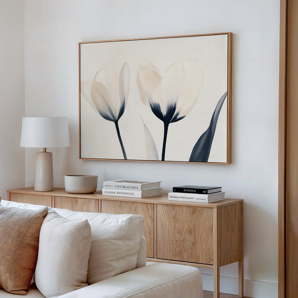 A minimalist living room featuring a light wood sideboard, white lamp, stacked books, ceramic bowl, and the Ethereal Blooms Canvas Art - Horizontal above—perfect inspiration for modern Nordic Park-style spaces.