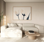 A modern living room features a light beige sectional, a low wooden coffee table, and the Ethereal Blooms Canvas Art - Horizontal. Neutral tones and soft natural light create the serene, minimalist feel of Nordic Park-inspired spaces.