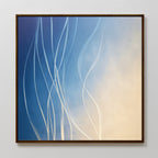 Ethereal Lines Canvas Art - Square features flowing white lines on a gradient from deep blue to soft beige, framed in dark wood and mounted on a light wall—a striking, modern print perfect for contemporary living room decor.