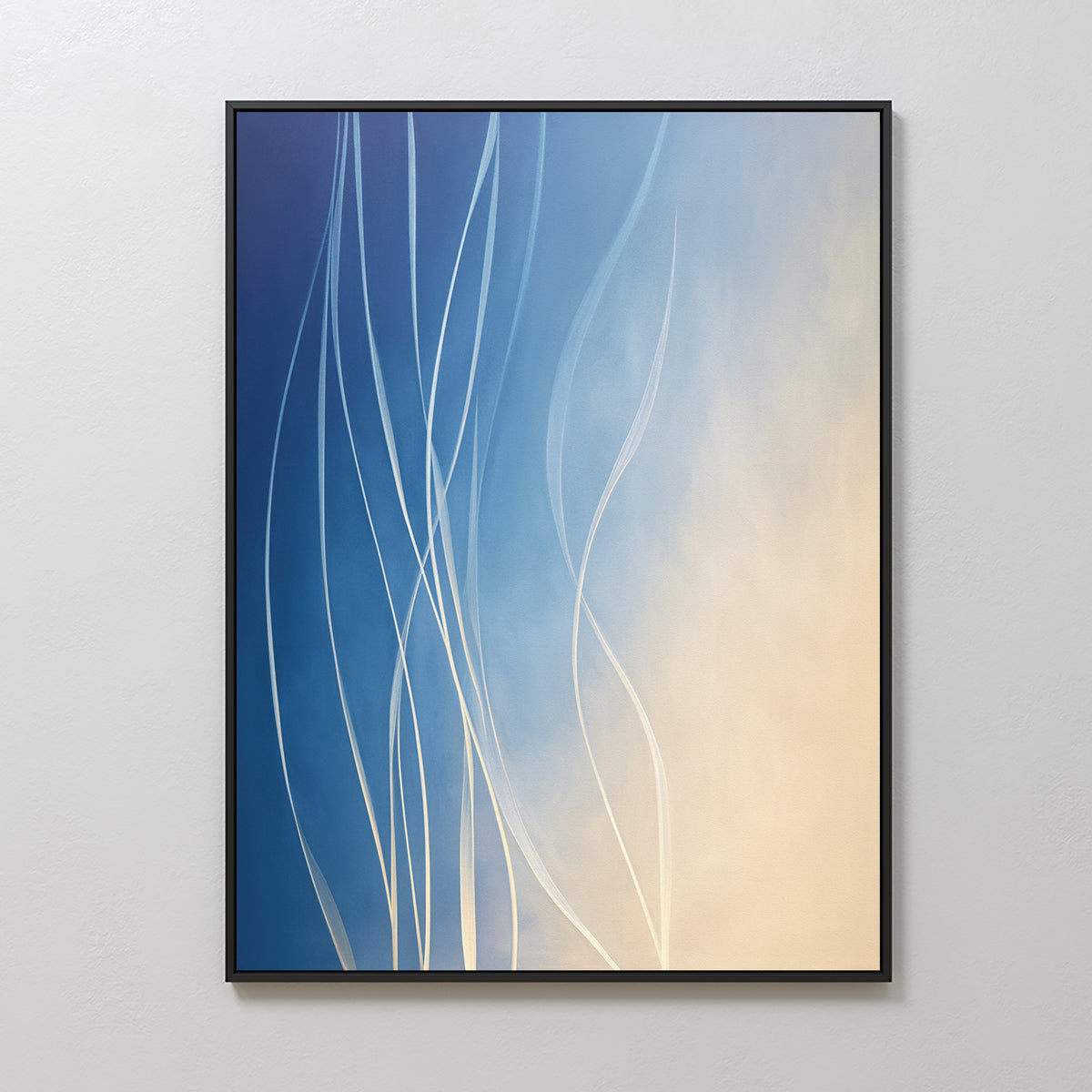 Ethereal Lines Canvas Art - Vertical: Thin white curved lines rise over a blue-to-beige gradient background. Framed in black and displayed on a light wall, it’s ideal for modern living rooms or Nordic Park-inspired decor.
