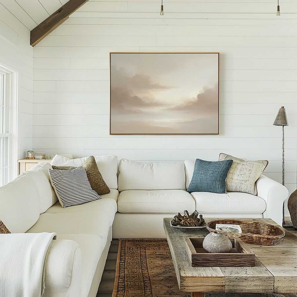A cozy living room with white shiplap walls, a large white sectional sofa with assorted cushions, a rustic wooden coffee table, and the Ethereal Veil Canvas Art - Horizontal adorning the wall.