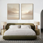 A modern bedroom features a low olive-green bed with white bedding, gold nightstands, beige lamps, and a textured rug. Above the bed hangs "Ethereal Veil - Set of 2," two large soft-toned canvas prints against the white wall.