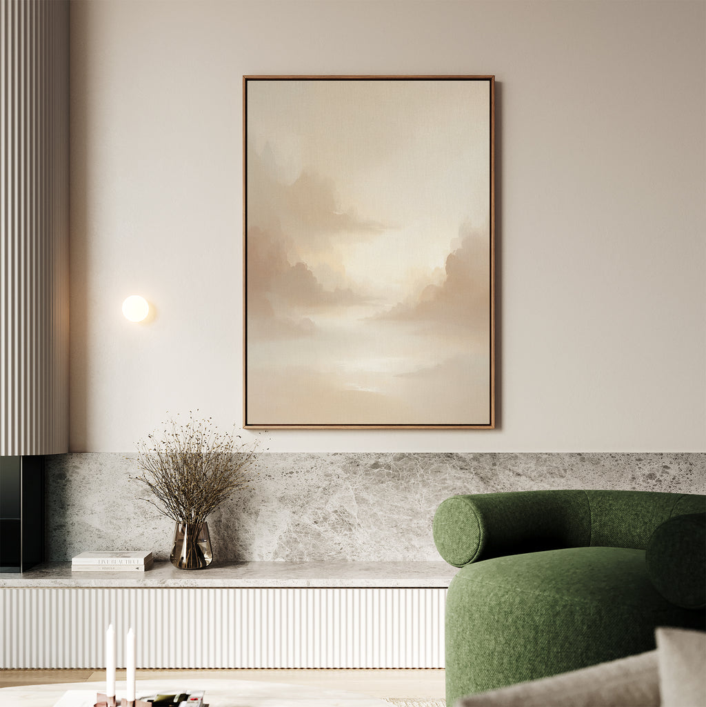 A modern living room with the Ethereal Veil Canvas Art - Vertical on the wall, a green curved sofa, a marble ledge topped with a vase of dried flowers, and soft neutral decor accents.