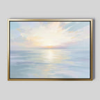 Elevate your space with Ethereal Waters Canvas Art - Horizontal, a framed seascape featuring soft pastels and gentle water reflections in a gold border—ideal for bringing serene sunrise or sunset vibes to any room.