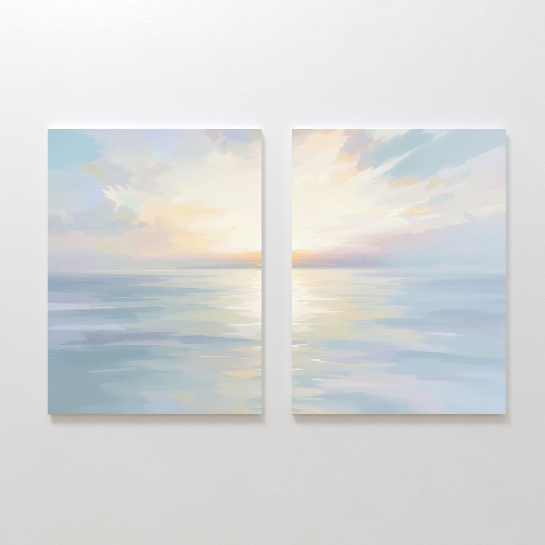 The "Ethereal Waters - Set of 2" features pastel seascape canvas prints of a tranquil sea and sky at sunset, with soft reflections and gentle clouds—perfect coastal artwork to create a serene atmosphere on any white wall.