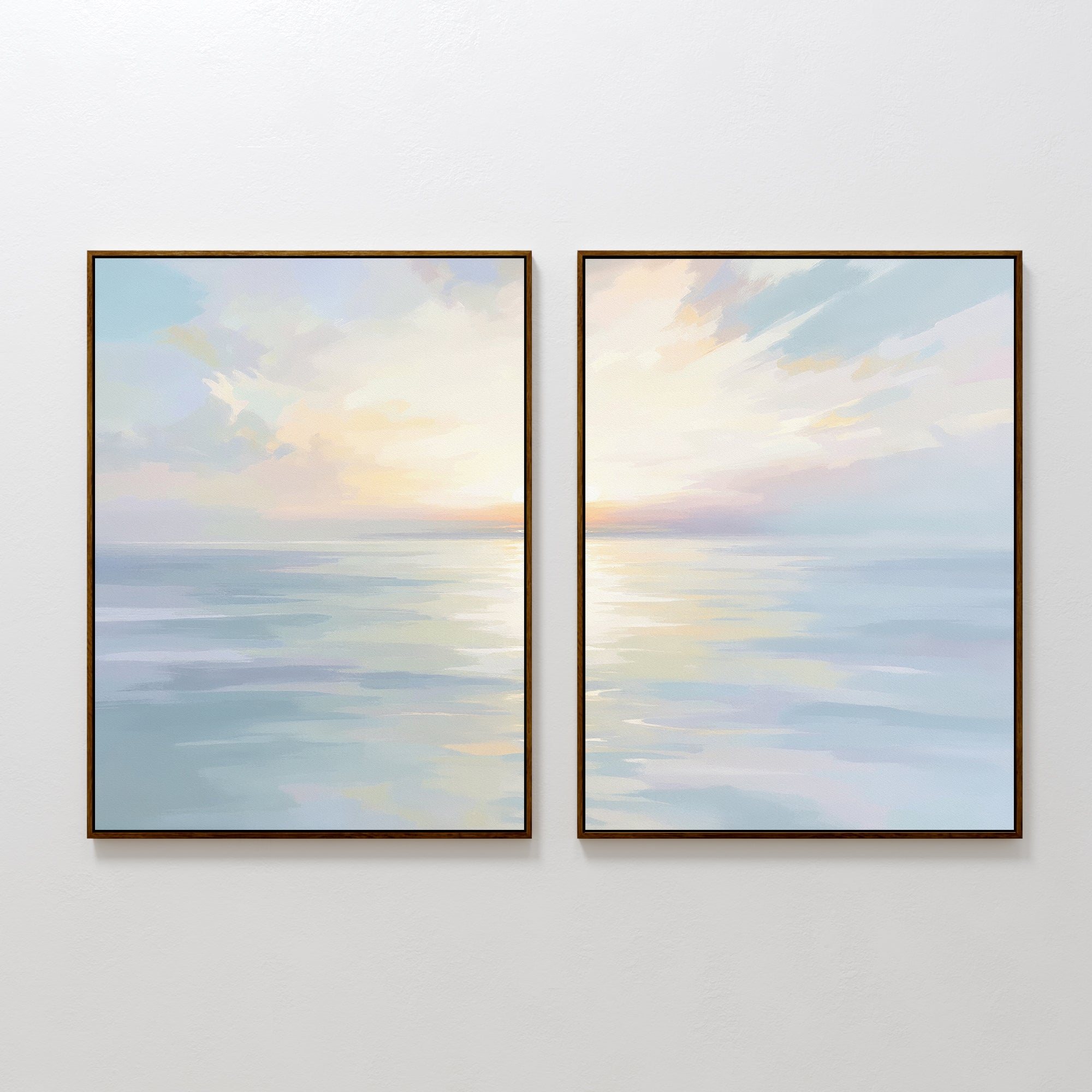 The "Ethereal Waters - Set of 2" features framed canvas prints of a calm ocean at sunrise or sunset, with pastel skies and soft reflections. This serene wall art duo is shown side by side on a plain white wall.