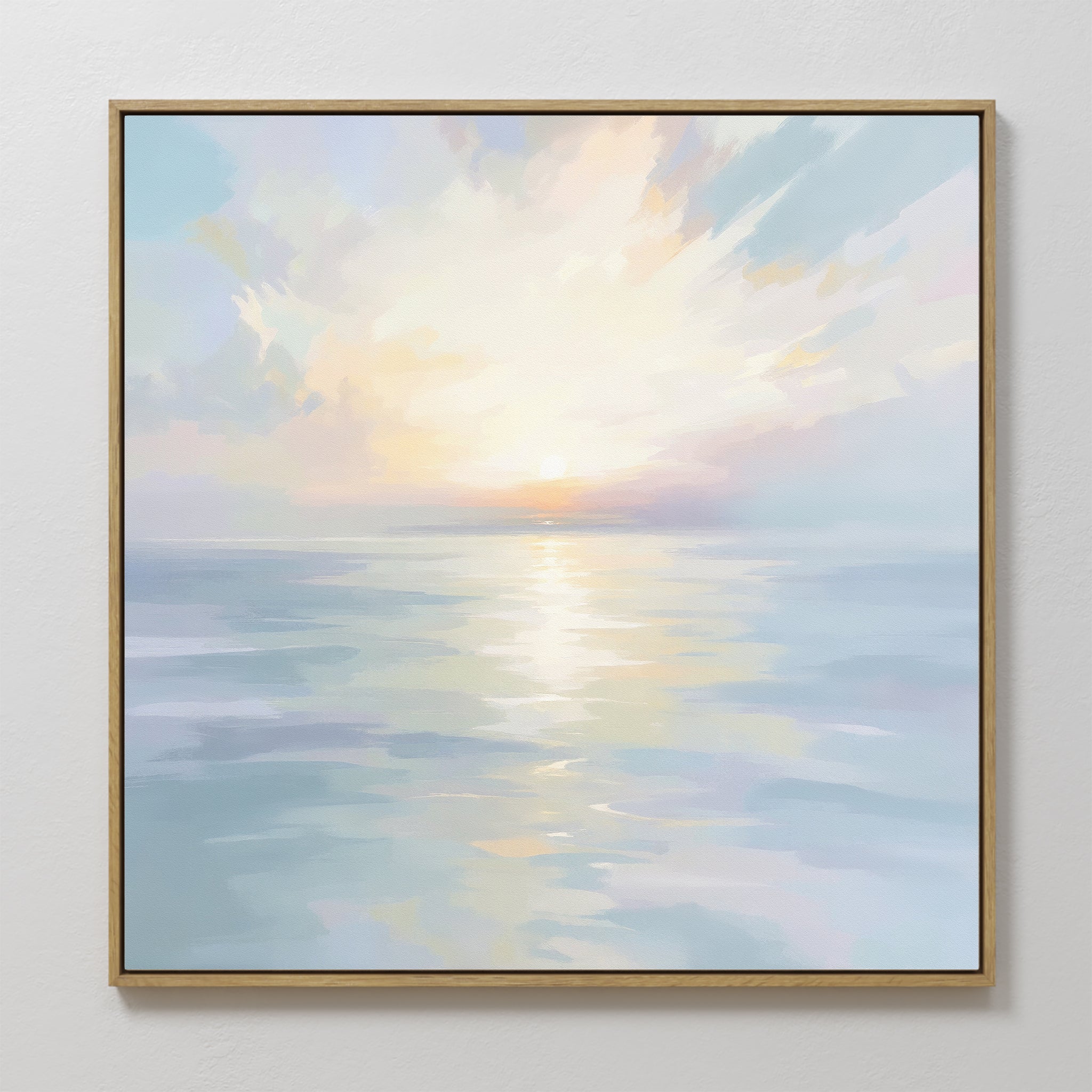The Ethereal Waters Canvas Art - Square features a tranquil sunrise or sunset over calm water, with pastel hues and light clouds—a serene, framed wall art piece that adds calming beauty to any room.