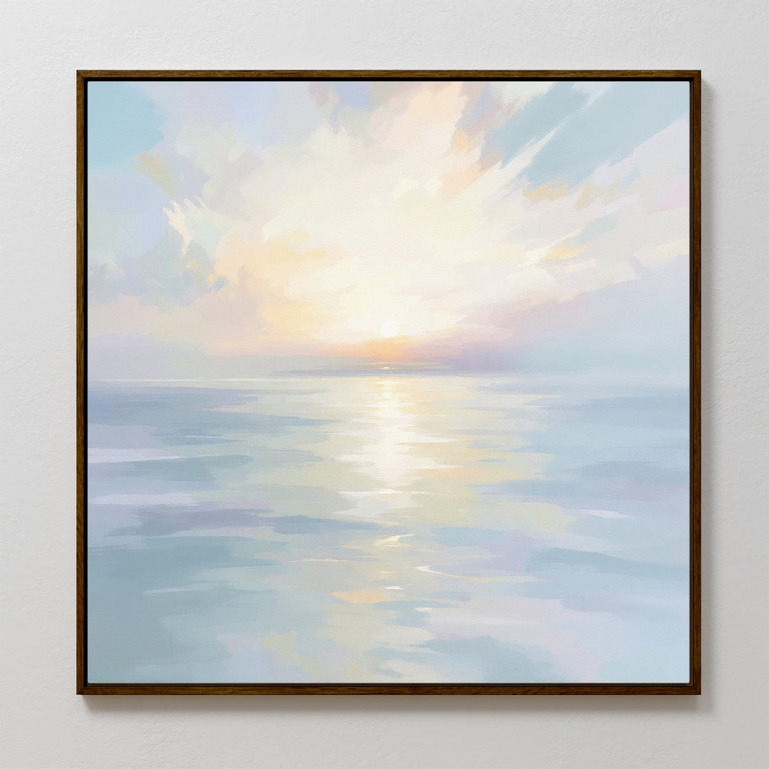 The Ethereal Waters Canvas Art - Square features a framed seascape of calm ocean waves and a pastel sky, bringing serene, coastal charm and a peaceful atmosphere to any space.