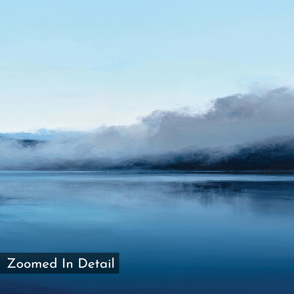 Fjord Mist Canvas Art - Horizontal features a serene blue lake reflecting misty clouds and mountains beneath a pale sky. "Zoomed In Detail" in the lower left adds interest, making it ideal for Nordic wall art or tranquil home decor.
