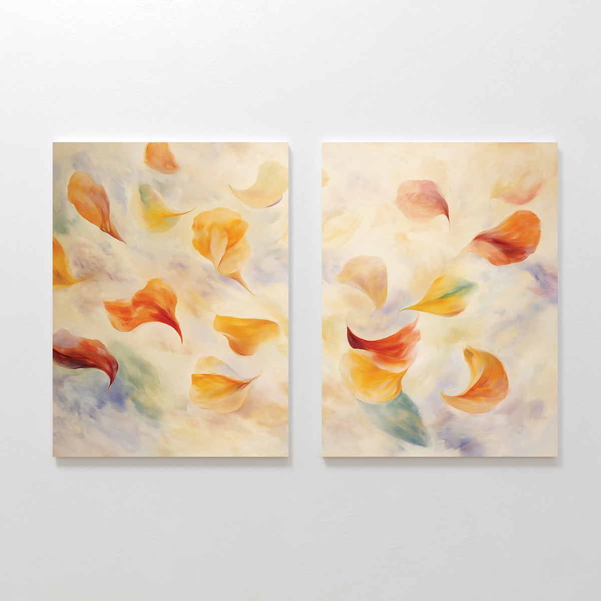 Floating Petals - Set of 2 features canvas paintings with swirling petals in warm yellow, orange, and red on a soft blue-green background. The art exudes organic elegance with an airy, delicate feel.