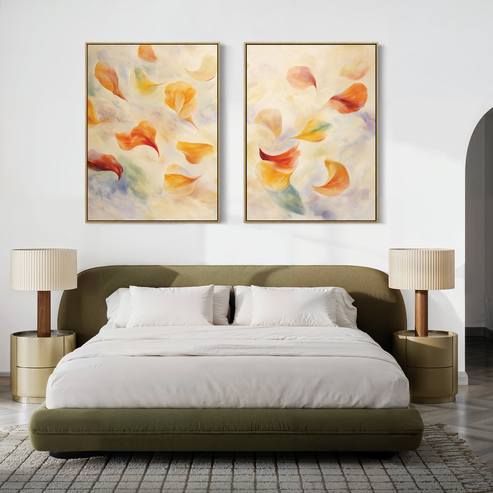 A modern bedroom featuring an olive green upholstered bed, white bedding, beige nightstands with matching lamps, and "Floating Petals - Set of 2" canvas prints above the headboard for a touch of organic elegance.