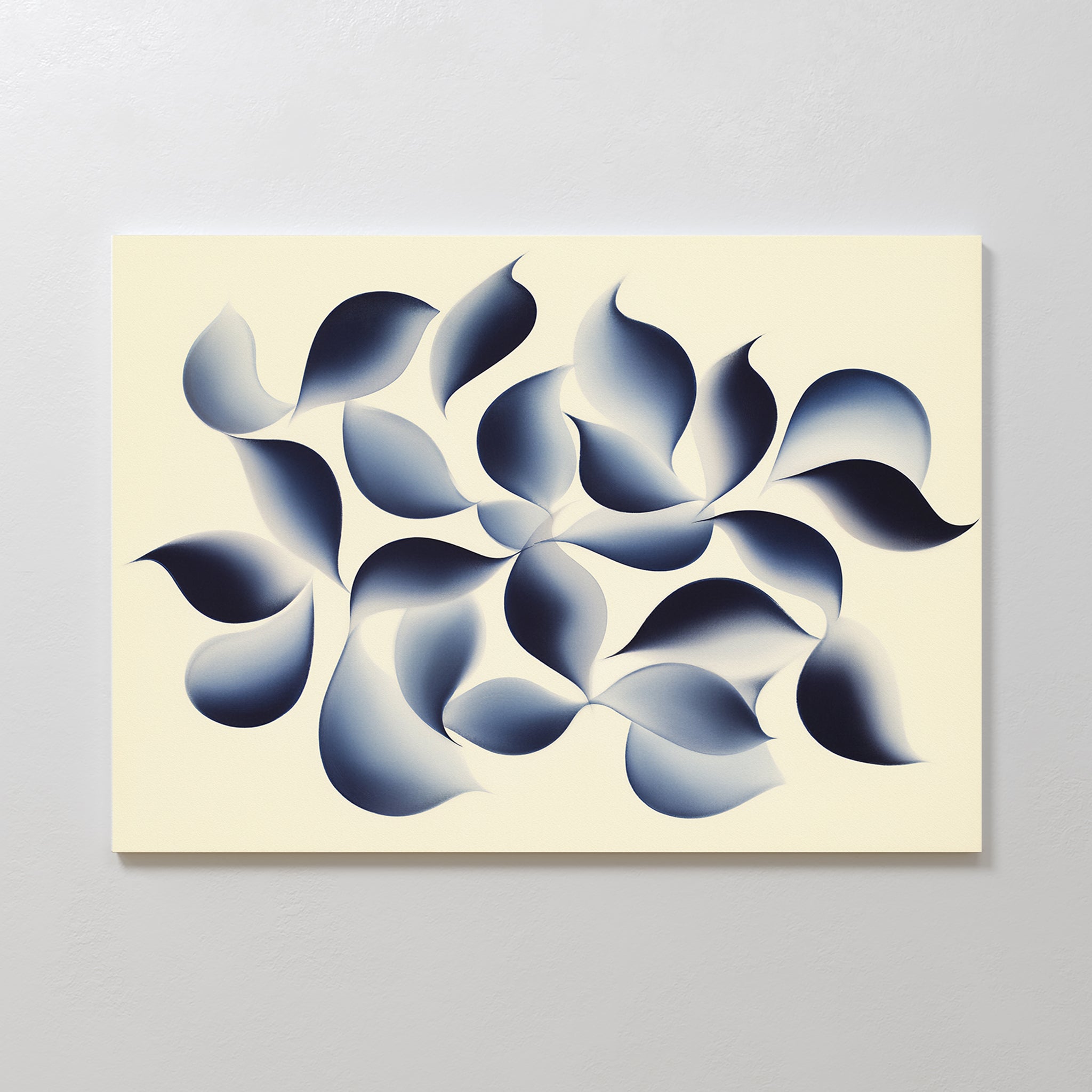 Flowing Shadows Canvas Art - Horizontal features dark blue and gray gradient leaf-like forms swirling on a light beige background. This indigo wall art adds dynamic movement, perfect for enhancing modern living rooms.