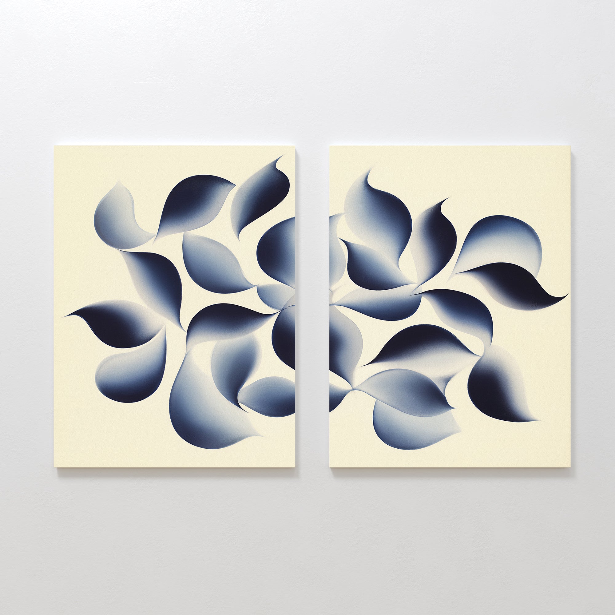 Flowing Shadows - Set of 2 showcases indigo abstract canvas prints with swirling dark blue, leaf-like shapes on a beige background, bringing movement and modern balance—ideal for living room decor.