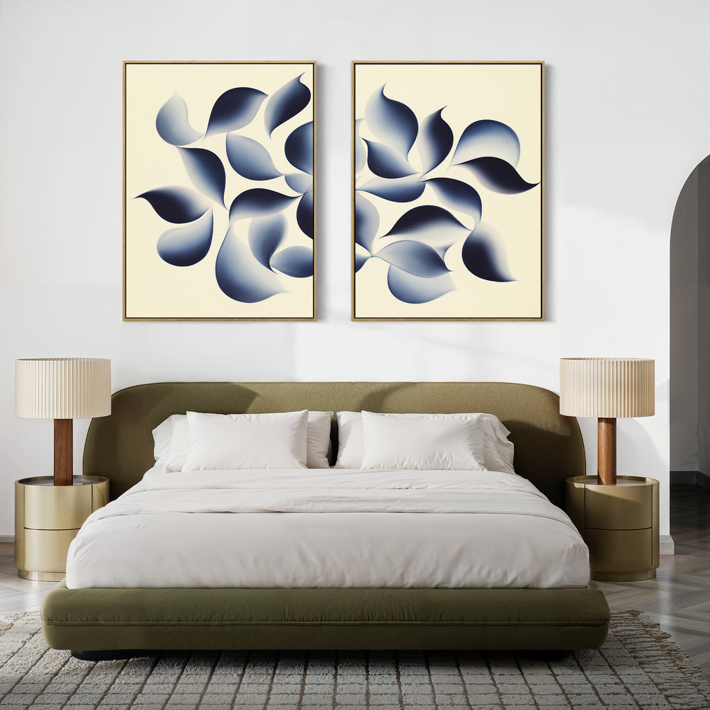 A modern bedroom with a low olive-green bed, white bedding, two beige nightstands with matching lamps, a neutral rug, and the "Flowing Shadows - Set of 2" abstract canvas prints displayed above the bed.