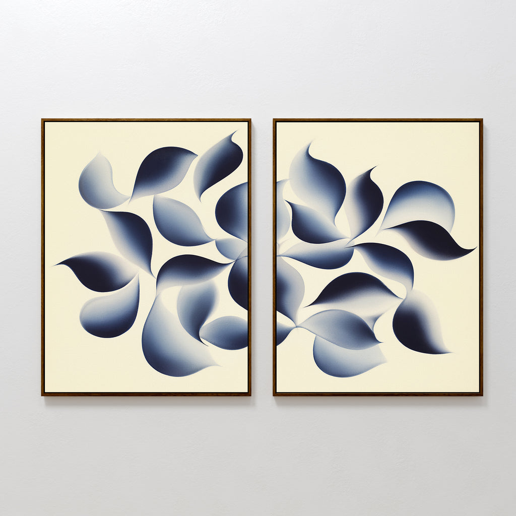 The Flowing Shadows - Set of 2 features abstract canvas prints with layered blue leaf shapes on a light background, arranged side by side—ideal indigo wall art for modern living room décor.