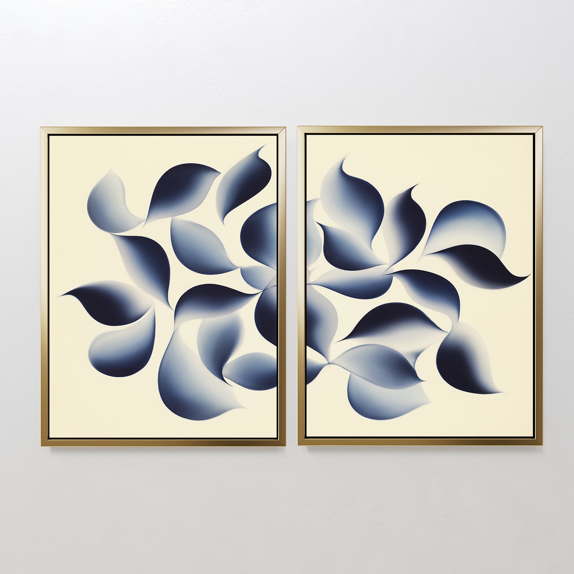 Flowing Shadows - Set of 2: Framed abstract canvas prints with overlapping blue and gray leaf-inspired shapes on a beige background, perfect minimalist indigo wall art to elevate your modern living room decor.