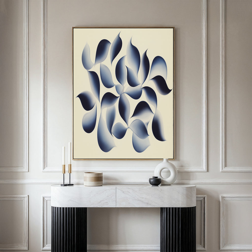 A minimalist room with a marble console table, decorative accents, and the "Flowing Shadows Canvas Art - Vertical"—a large abstract print with blue and gray curves on a light background—mounted on a paneled wall, showcases modern living room decor.