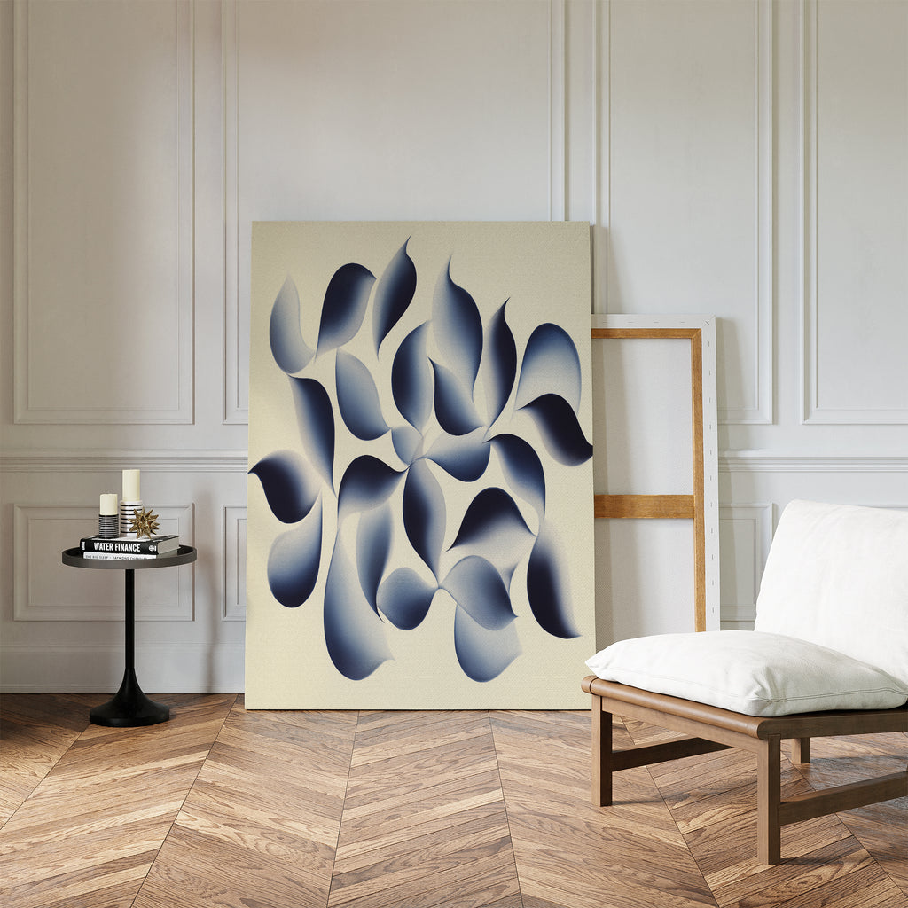 A modern living space with herringbone wood floors, white walls, a cushioned chair, a small round table with candles, and calming wall art—Flowing Shadows Canvas Art - Vertical in blue and gray—leaning against the wall.