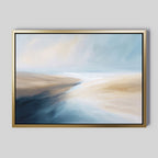Fluid Motion Canvas Art - Horizontal features soft, flowing brushstrokes in blue, beige, white, and tan for a coastal vibe. This framed abstract print is ideal for modern living rooms, especially on a light gray wall.