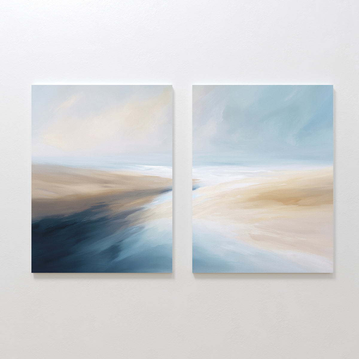 Fluid Motion - Set Of 2 features abstract landscape prints with soft blends of blue, beige, and white—ideal as coastal wall art to add a serene, modern vibe to your living room decor.