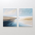 Fluid Motion - Set Of 2 features abstract landscape prints with soft blends of blue, beige, and white—ideal as coastal wall art to add a serene, modern vibe to your living room decor.