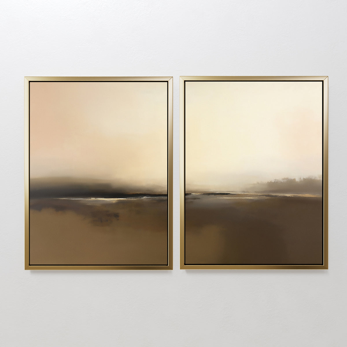 The Foggy Beach Expanse - Set Of 2 features abstract landscapes in gold frames, with soft brown, beige, and cream tones. Hung side by side on a white wall, they evoke serene sophistication with their calm, dreamy horizons.