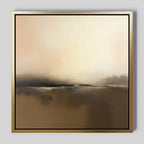 Foggy Beach Expanse Canvas Art - Square showcases a serene landscape in warm beige and brown, with a hazy horizon and soft light. This Nordic decor piece is framed in gold and black, perfect for display on a gray wall.