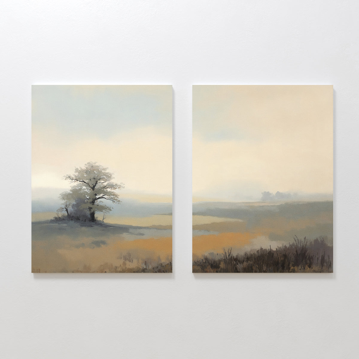 The "Foggy Solitude - Set of 2" features canvas art with misty landscapes in soft, muted colors—one showing a tree and grassland, the other an open field under a hazy sky—ideal for creating tranquil wall decor.