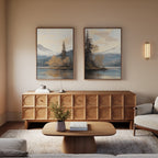 A cozy living room with a carved wooden sideboard, the Frosted Ascent - Set of 2 canvas paintings above, a round wooden coffee table with a vase, and a soft armchair. Warm tones and gentle lighting create a serene atmosphere.