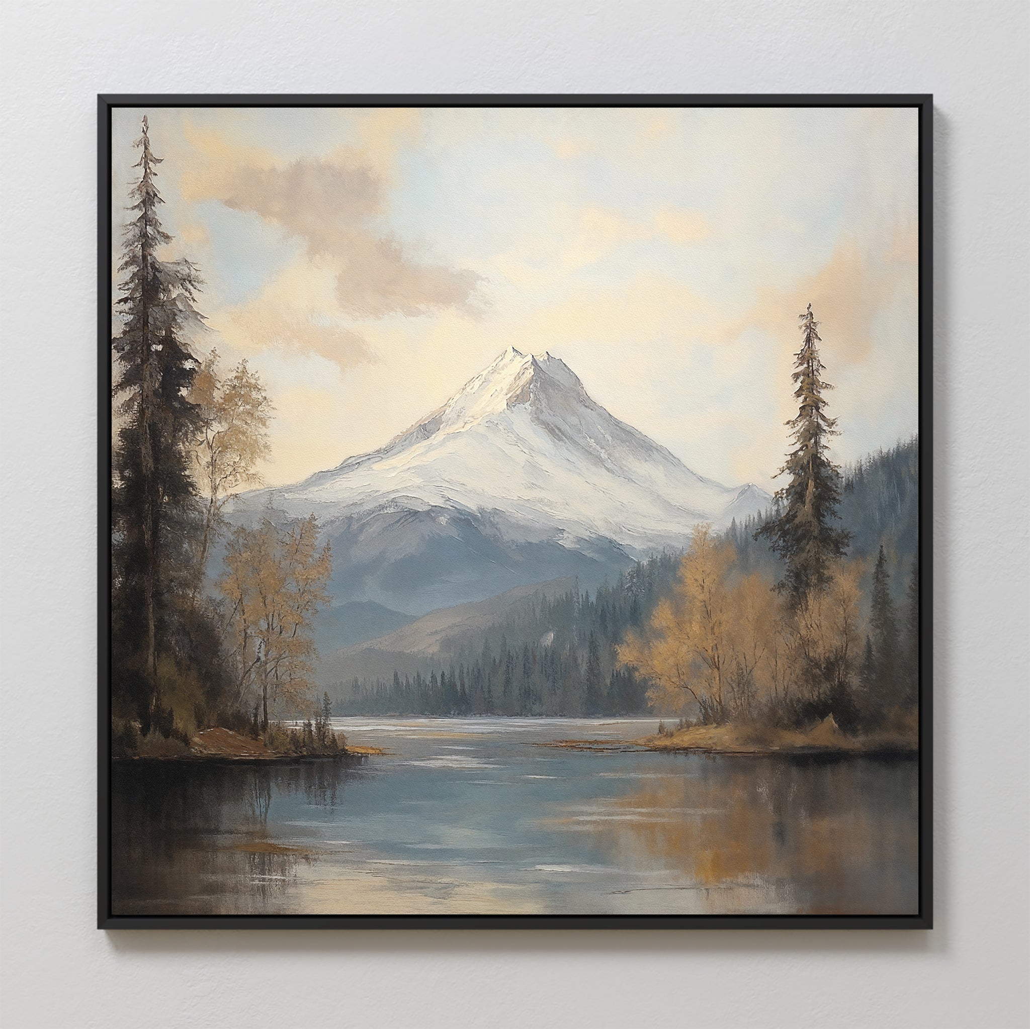 The Frosted Ascent Canvas Art - Square features a snowy mountain peak reflected in a tranquil lake, with evergreen and autumn trees beneath a partly cloudy sky—perfect peaceful wall art for any space.