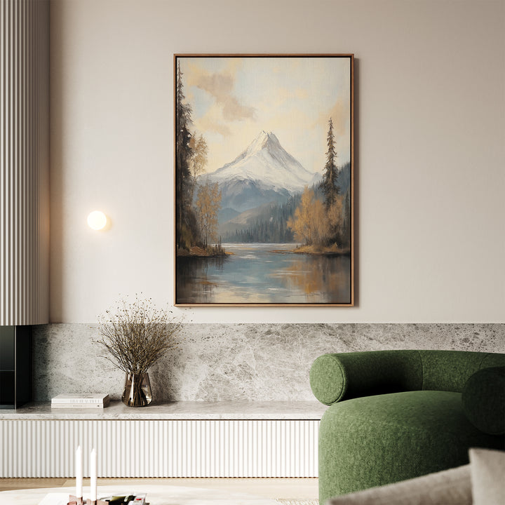 A living room with a green sofa, marble accents, and tranquil decor featuring the Frosted Ascent Canvas Art - Vertical above a shelf with a vase of dried branches.