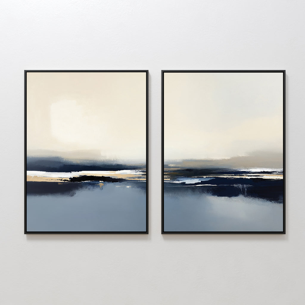 The Frozen Bay - Set Of 2 features framed abstract prints with soft beige, blue, and black tones, evoking tranquil seascapes. Displayed together on a white wall, they're ideal for modern living room decor with their serene, contemporary style.