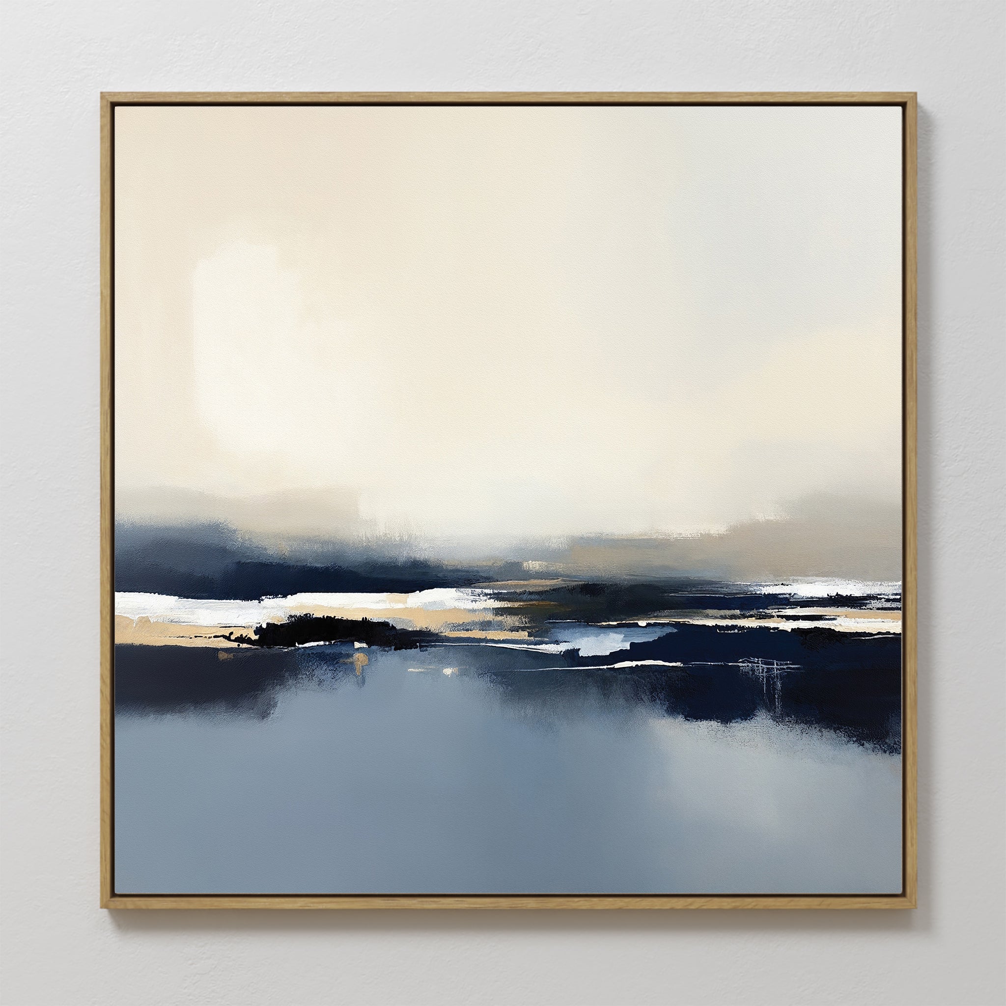 Frozen Bay Canvas Art - Square features soft, blended blue, white, beige, and dark gray tones that evoke winter waters. Framed in light wood and displayed on a white wall, it's ideal as a contemporary print for modern living rooms.