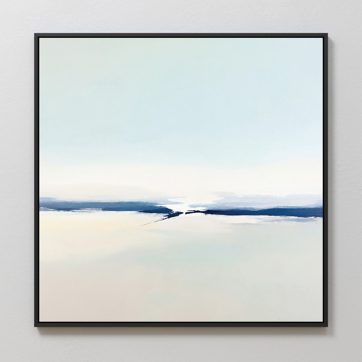 The Frozen Channel Canvas Art - Square showcases minimalist abstract design with soft white, beige, and light blue tones and a bold dark blue band. Framed in slim black, it adds serene elegance to modern living rooms against light-colored walls.