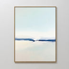 Frozen Channel Canvas Art - Vertical features serene pale blue, white, and beige gradients with a deep blue band. Framed in a slim, light frame and displayed on a white wall, it’s ideal for modern living room decor.