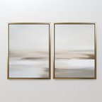 The Tranquil Shifts Set of 2 features abstract art with soft beige, white, and gray shades in thin gold frames—ideal minimalist wall art to bring a calm touch to your bedroom or modern living room decor.