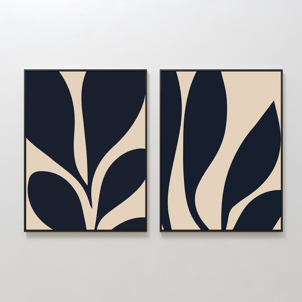 The Botanical Ink Set of 2 features abstract art prints with bold, dark organic shapes on a beige background, each framed in black—an eye-catching option for minimalist wall art in any modern home.