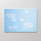 The Gentle Blossoms Canvas Art - Horizontal features delicate white floral motifs on a soft light blue background, adding a serene and airy touch to your space.