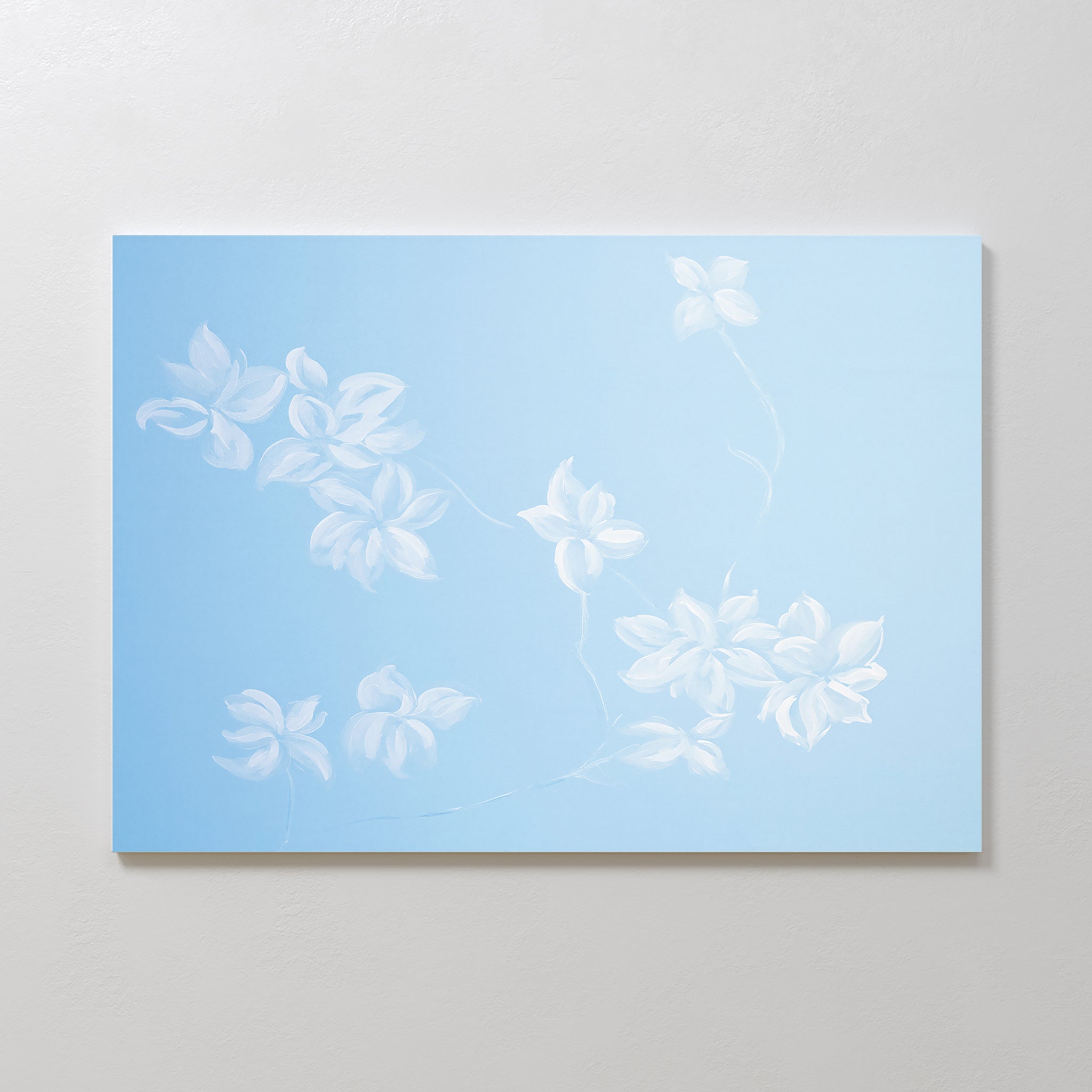 The Gentle Blossoms Canvas Art - Horizontal features delicate white floral motifs on a soft light blue background, adding a serene and airy touch to your space.