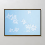 The Gentle Blossoms Canvas Art - Horizontal features delicate white flowers with soft petals on thin stems set against a light blue background, adding subtle floral motifs to any plain, light-colored wall.