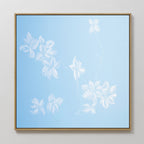 The Gentle Blossoms Canvas Art - Square features delicate white floral details and leaves on a light blue background, framed in thin gold for a soft, airy, and minimalist wall art piece.